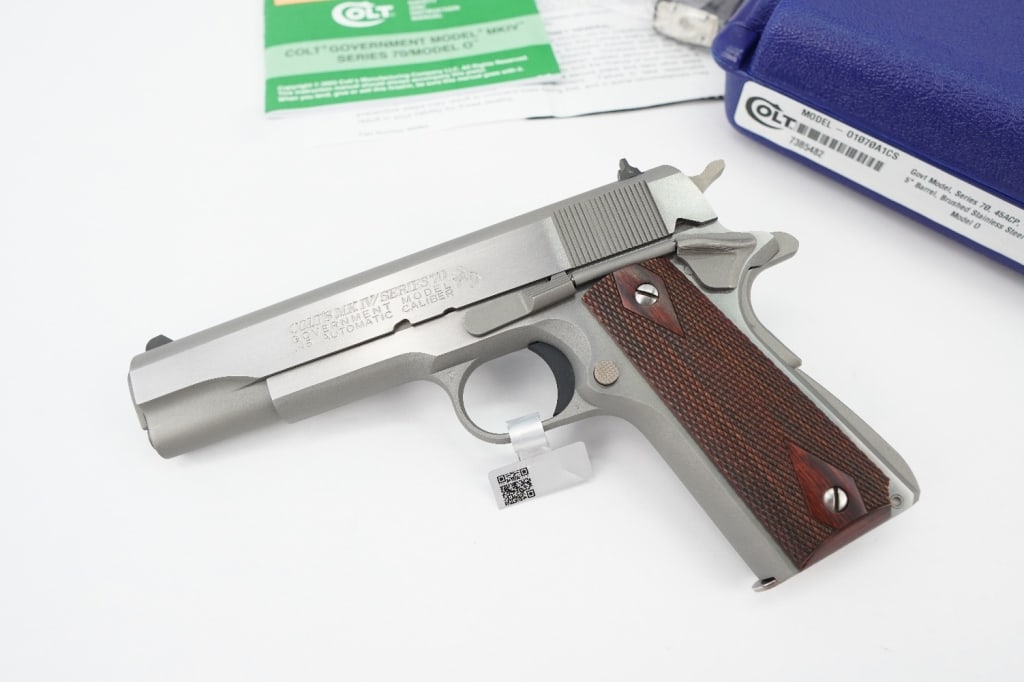 Colt Government MK IV .45 Auto: This Colt Govt model is a series 70 Model 0 Brushed stainless steel Chambered in 45acp featuring a 5 inch barrel. To all outward appearances, the Series 70 is a gussied-up M1911A1. It has the frame, s