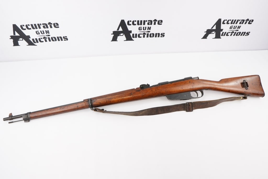 Italian Made Carcano FAT 42 6.5x52: This is an Italian Carcano FAT 42 in 6.5x52mm with a five round capacity and a 28 inch barrel. Originally intended for Australian export and came to the US. This Rifle is in Very Good condition for it