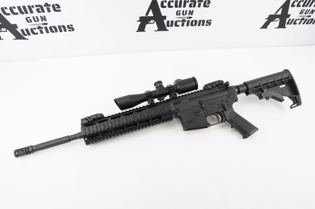 The Arms Room TAR-15 5.56 NATO: This AR-15 is produced by The Arms Room and is chambered in 5.56 NATO. The rifle is fitted with a scope and sold without a magazine. The firearm is in excellent condition, showing minimal signs of use