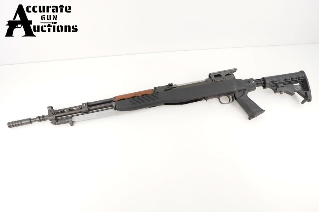 Inter Ordnance M59/66 7.62x39mm: This M59/66 SKS from Inter Ordnance is a semi-automatic rifle chambered in 7.62x39mm. A 23" barrel is paired with a scope mount. The laminate wood stock is further accompanied by an attached folding b