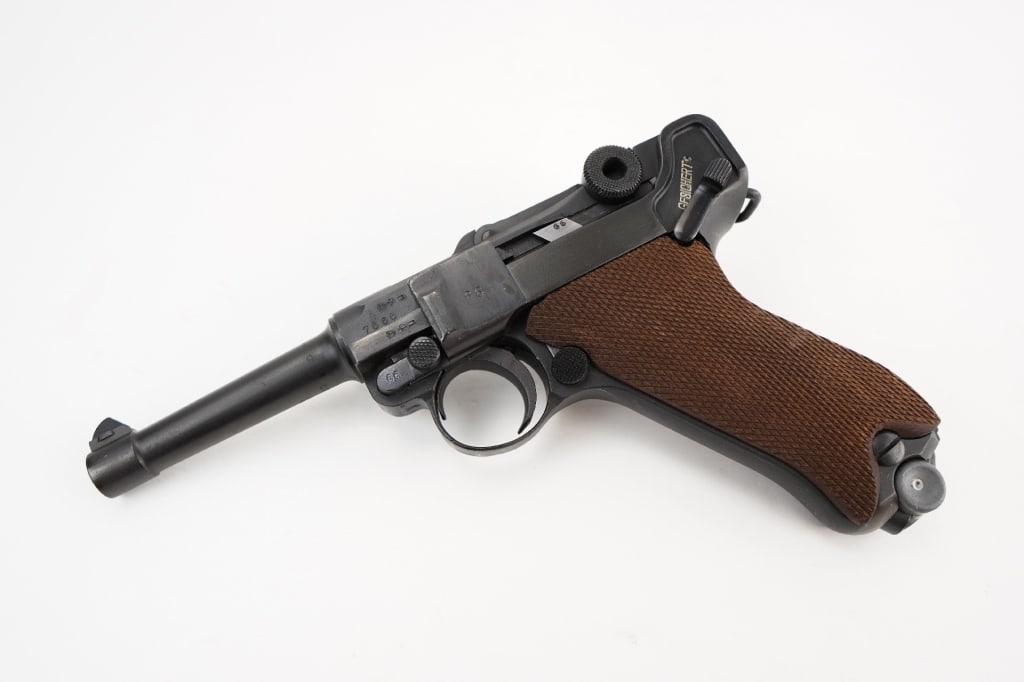 DWM P08 9mm Luger: "A Deutsche Waffen und Munitionsfabriken (DWM) Model 1906 Commerical Luger. Features mostly matching serial numbers (barrel appears to be marked differenlty) and all proper proof marks on the firearm 