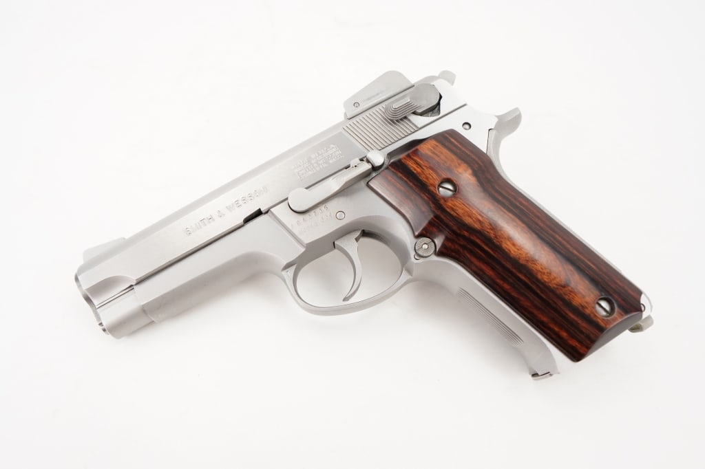 Smith & Wesson 659 9mm: The Smith & Wesson 659 is a traditional double-action high-capacity 9x19mm caliber pistol. Stainless steel version of the blued, alloyed framed Smith & Wesson 459 and blue all-steel Smith & Wesson 559