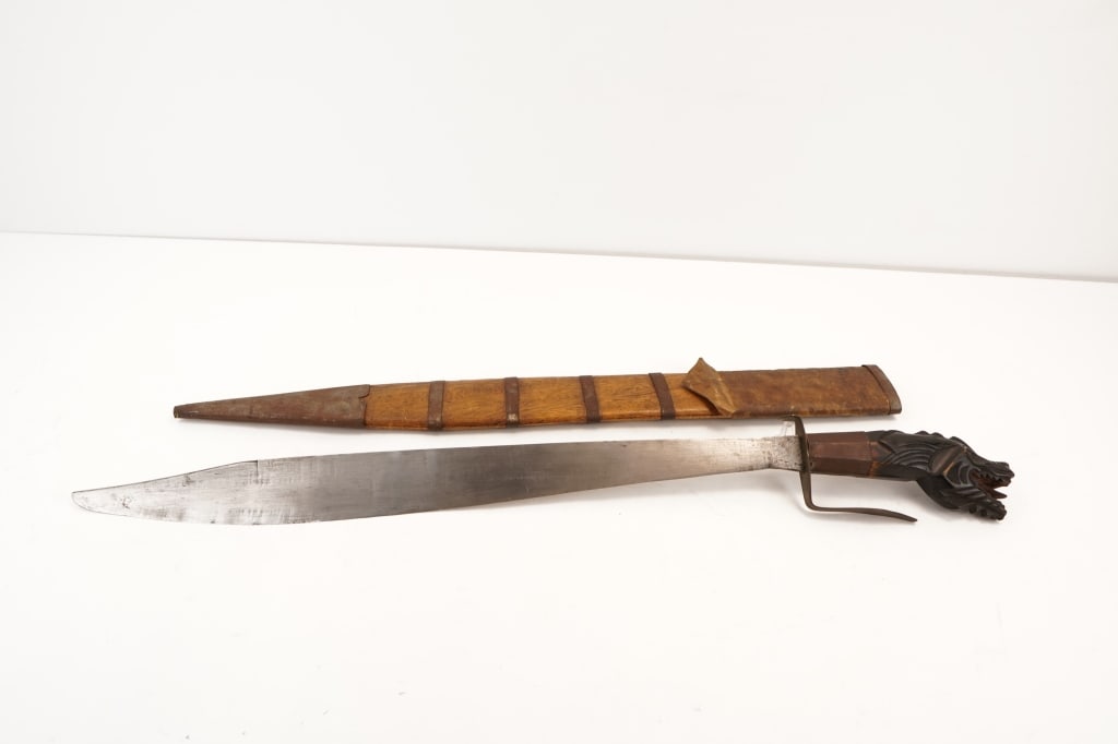 Sword: Believed be dated back to early Eastern Asia, this unique "Dragon Headed" sword is sold with a custom made sheath. Please see the photos.