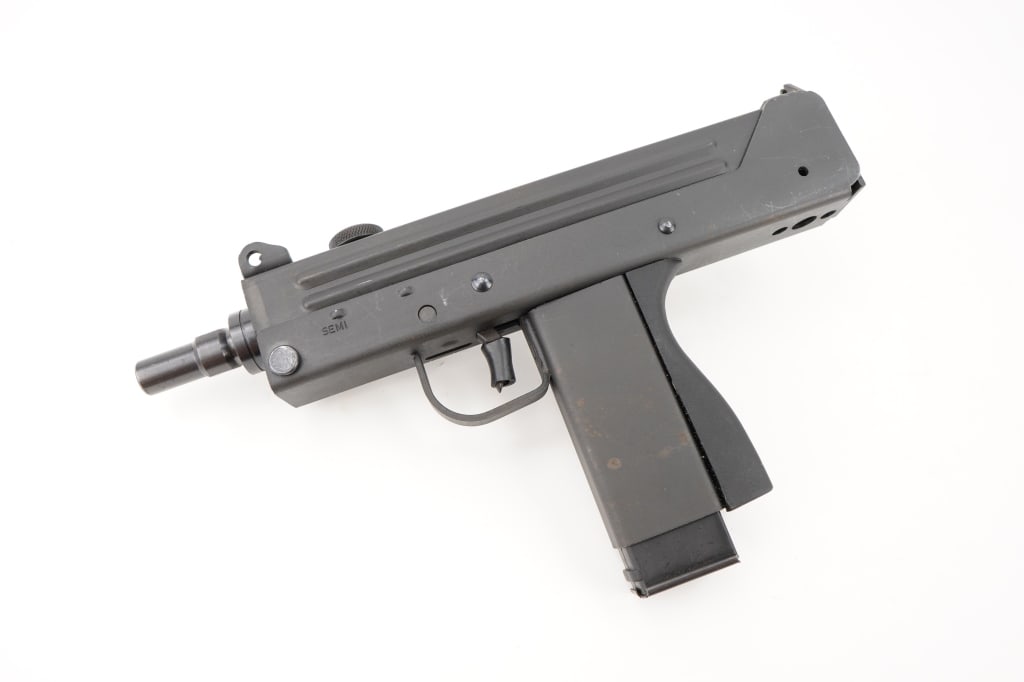 Cobray PM-11 9mm: Live out your favorite 80's action movie on the range! The Cobray PM-11 is a compact 9mm semi-automatic pistol engineered for superior performance in a sleek package. This pistol remains in Great cond