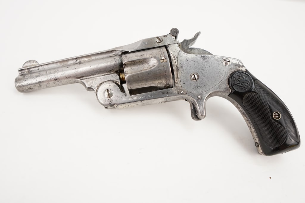 Smith & Wesson Top Break .38 S&W: Smith and Wesson nickel plated 38 center fire with spur trigger. This revolver features a 3.5” barrel with a bright/frosty bore. This revolver is in good condition for its age, shows signs of ag