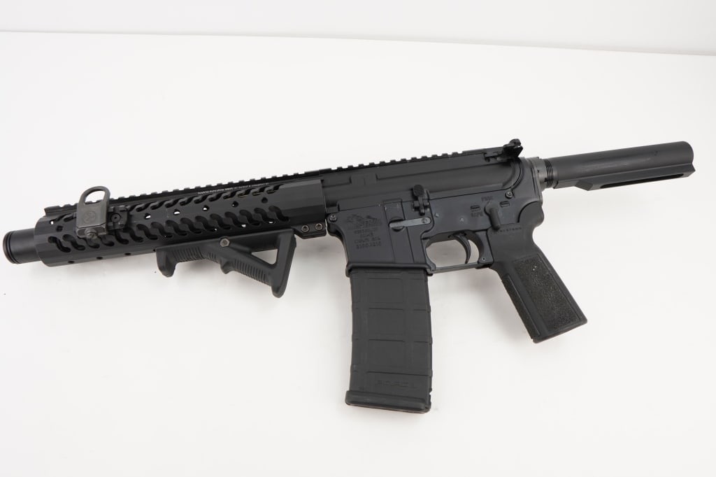 Anderson AM-15 5.56: This Anderson AM-15 AR Pistol is chambered in 5.56 Nato and sold with one magazine. The pistol features a 10” barrel, slanted foregrip, and buffer tube. The pistol is in very good condition show