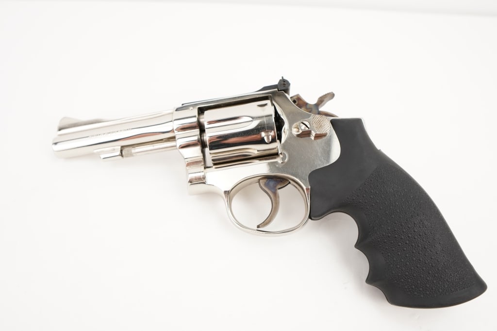 Smith & Wesson 15-3 38 S&W Special CTG: The Smith & Wesson Model 15-3, also known as the "K-38 Combat Masterpiece" is a revolver that was commonly used by law enforcement and private citizens. It features a 4" barrel and is chambered in 38