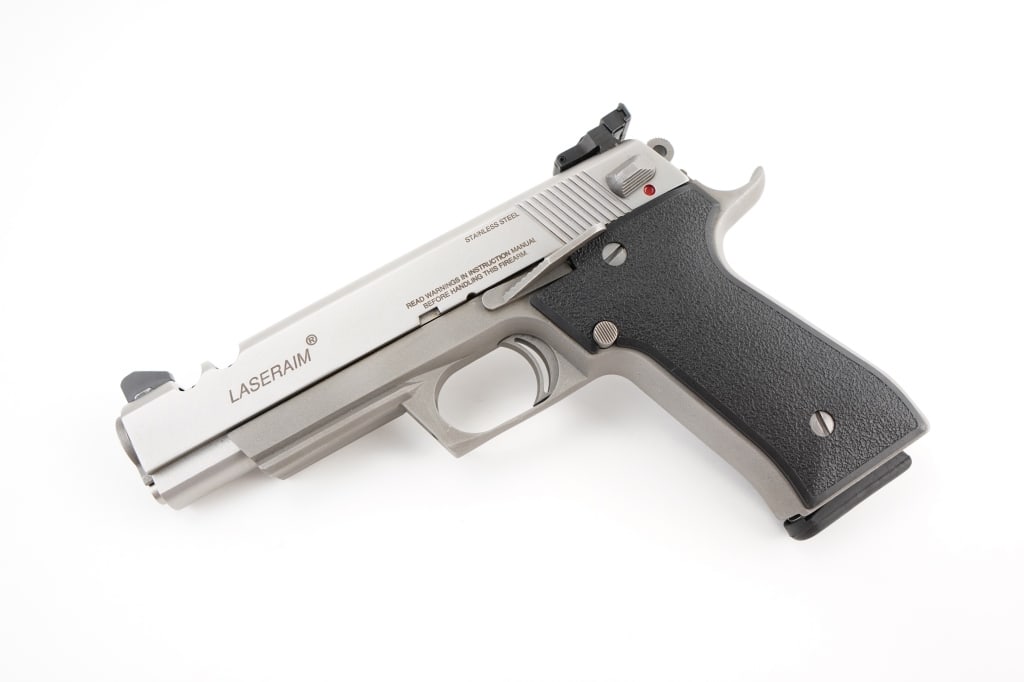 Laseraim Arms Series II .45 ACP: The LASERAIM series were ported .45 ACP pistols based on the original M1911 design, but incorporating elements of the BHP and the CZ-75. The unique feature of this pistol was a hole cut out of the tri