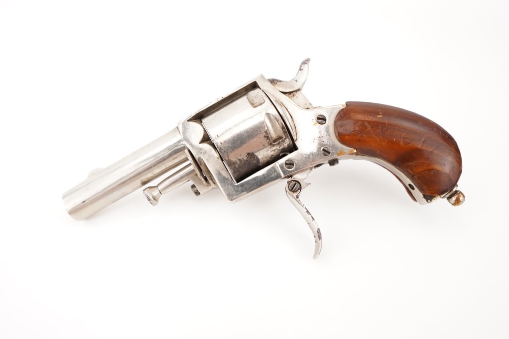 NVM British Bulldog 0.32: This is a rare NVM British Bulldog revolver chambered in .32 caliber, an iconic pocket-sized firearm favored for its compact design and reliable performance. This classic revolver features its origina