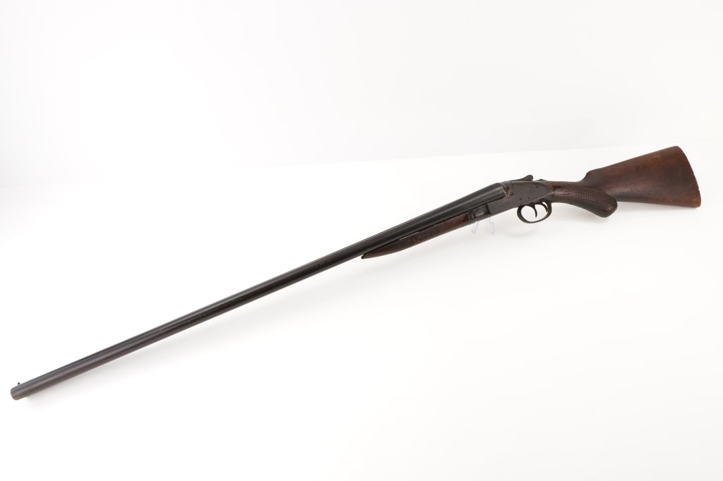 American Gun Co. Knicker Bocker 12 GA: This American Gun Co. Knickerbocker 12-gauge shotgun showcases classic craftsmanship, renowned for its robust double-barrel design and utilitarian elegance. Produced by Crescent Firearms for American 