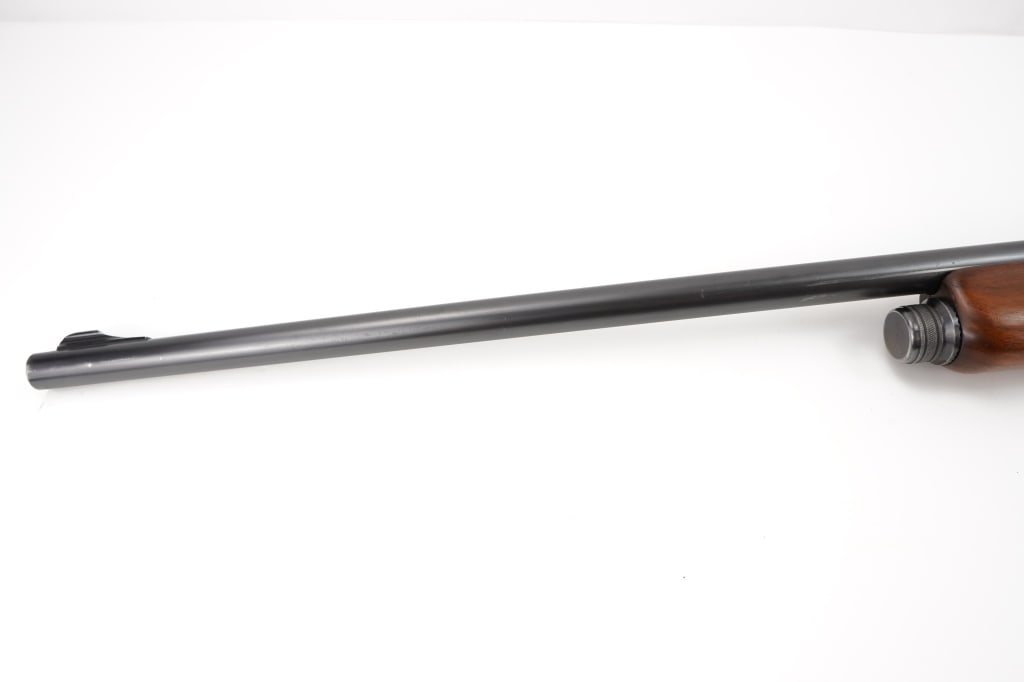 Winchester 40 12GA: This Winchester Model 40 12GA, produced between 1940-1941, is a rare semi-automatic shotgun with a limited production run, making it highly collectible. Featuring a streamlined design and quality craf