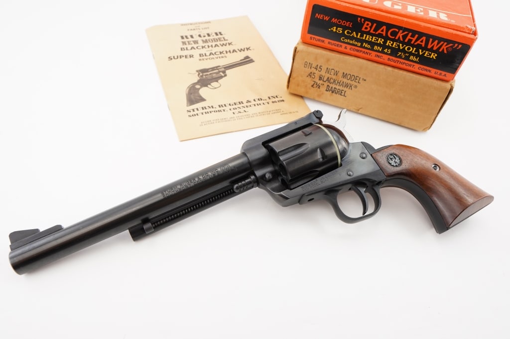 Ruger New Model Blackhawk .45 Cal: This Ruger New Model Blackhawk .45 Cal is a pristine example of craftsmanship. Featuring a robust stainless steel frame and Manufactured in 1995, it remains in excellent condition, with the original b