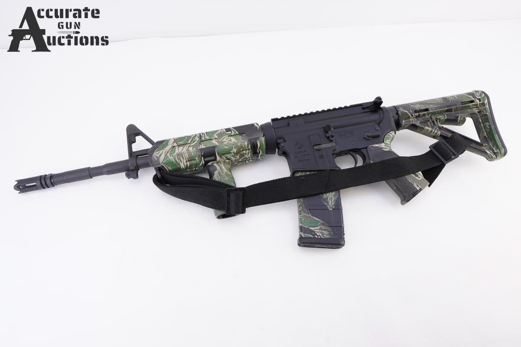 Colt Carbine 5.56 MM: Carbine is a semi-automatic rifle chambered in 5.56x45mm NATO, featuring a 16.1-inch chrome-lined barrel with a 1:7 twist rate. It has a matte black finish, a 4-position collapsible synthetic stock, a