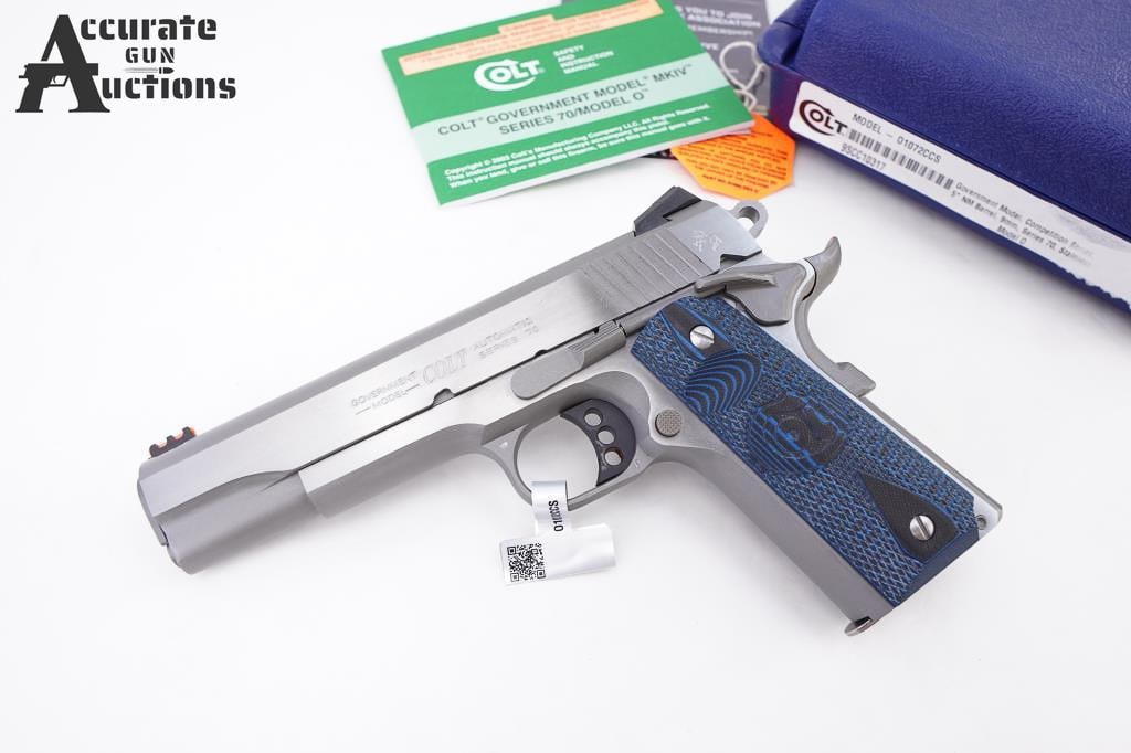 Colt Series 70' Government Mod 9MM Luger: Colt's 1911 competition pistol features custom g10 blue checkered grips; dual recoil spring system; a national match barrel; Novak sights for precision shooting, a red fiber optic front with adjustabl