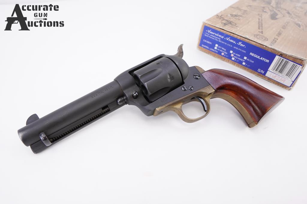 Uberti S.A.A .45 LC: An Uberti contract clone of the famous Colt S.A.A by Cabela's. This example has a parkerized finish, brass backstrap / trigger guard, 6 shot fluted cylinder, fixed sights, and rose wood grips. Include