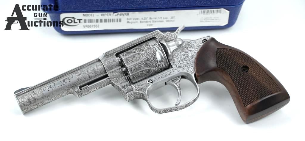 Colt Viper Engraved .357 Mag: Make: Colt Model: Viper Engraved Caliber: .357 Mag Action: SA/DA Barrel: 4.25 Bore: Bright Serial # VR007552 Condition: Excellent Collectible Fully engraved to Colt's custom shop perfection! This stai