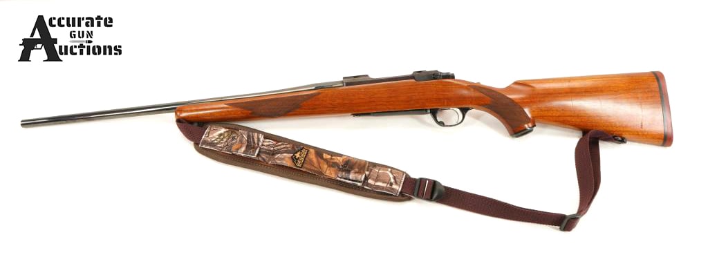 Ruger M77 .243 Win: Make: Ruger Model: M77 Caliber: .243 Win Action: Bolt Barrel: 22 Bore: Bright Serial # 771-18980 Condition: Good This Ruger M77 in .243 Win. It has a deep blue finish, a factory checkered walnut