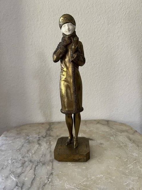 Art deco bronze & mammal tusk sculpture by j.p.morante: Girl about town and chilly by Morante.extremely rare art deco10 1/4” x 2 5/8” (larger version) 2LbsNo other bronzes ever found with this Artist.A must for a serious collector.Even Brian hi