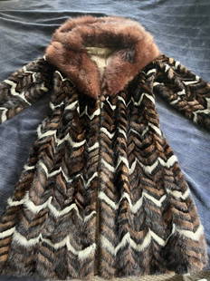 Mink fur coat: Zigzag fur coat in perfect condition.preserved for over 4 decades and used about 7 times.No shedding, no smell of any kind due to age.kept in cedar closet for decades.purchased on 1974 in London uK.No