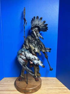 David Lemon bronze “feathers in the wind” 31” tall: Beautifully patinaed and painted Native American warrior bronze by David Lemon titled “feathers in the wind”31” tall on rotating wood base Number 14/30Great condition