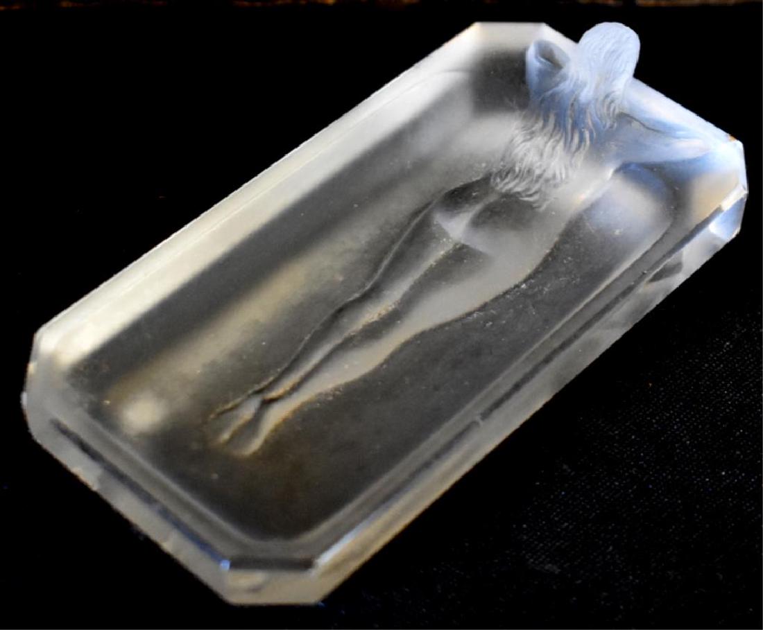 ART DECO FROSTED NUDE PIN DISH: Pin dish is in the style of Lalique and depicts a bathing female nude. It is embossed with an unknown maker's mark on the bottom. The dish shows minor scuffing and corner nicks -- signs of use commens