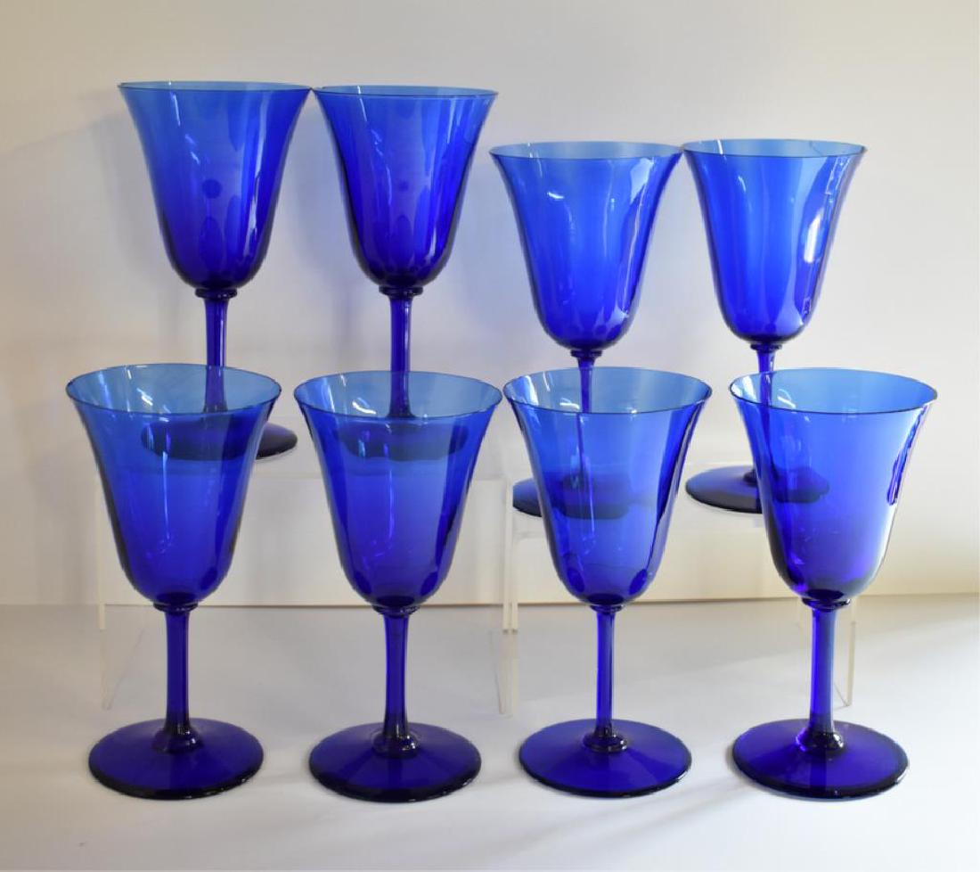 EIGHT COBALT BLUE WINE GLASSES: Each wine goblet measures 6Â½" tall. Some are chipped.
