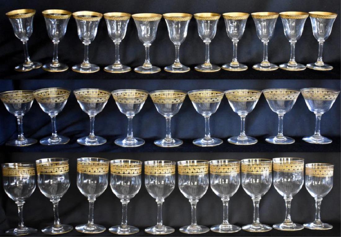 ANTIQUE GOLD-TRIMMED STEMWARE: Includes nine 5Â½" goblets, nine 4" wine glasses, and one 4Â¾" stem in a matching Greek key pattern. Lot also includes eleven cordials. Glasses all appear to be in nice overall condition.