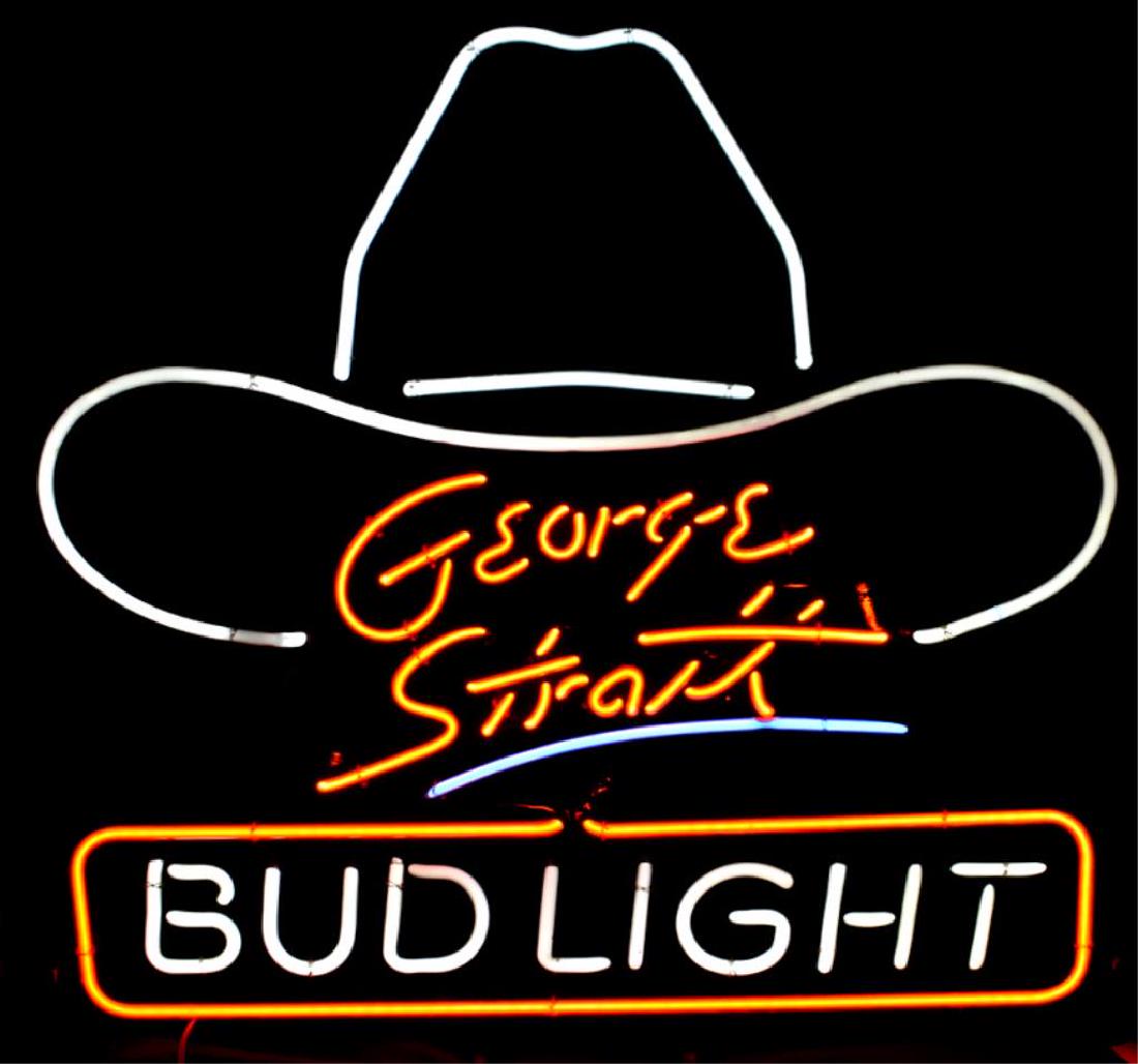 BUD LIGHT NEON BEER SIGN: Anheuser Busch "Bud Light" neon sign measures 29.5" tall x 30" wide and features the signature of George Strait with a cowboy hat.