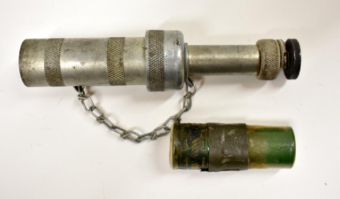 RARE WWII US NAVY HAND FLARE GUN & UNUSED SHELL: US Navy handheld MK4 10 gauge antique flare pistol is marked "US Hand Projector MK4 Contract No NORD 4039 EVCC". It was built by Eureka Vacuum Cleaner company. Lot also contains an unused flare shell.