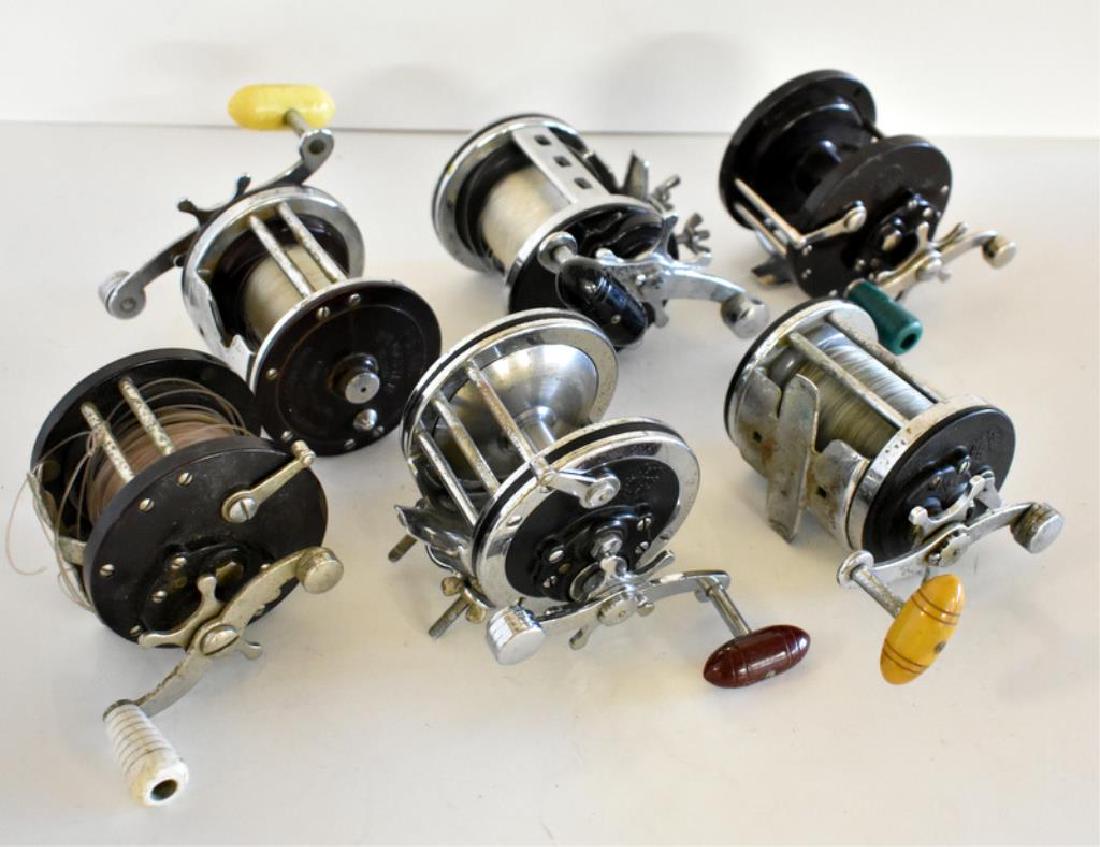 SIX VINTAGE PENN LEVEL WIND FISHING REELS: Includes two model no. 85 reels, a no. 200, a no. 500, a Jig Master high speed, and a Senator 2/0.