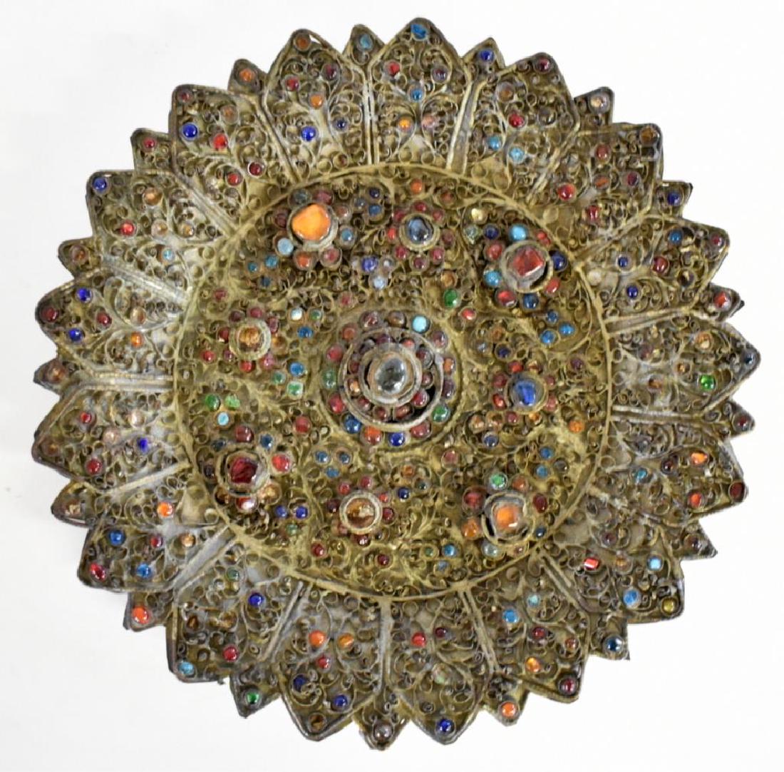ETHNIC BRONZE FOLIATE PLATE WITH COLORED CABOCHONS: Plate features intricate raised filigree work and hundreds of colored glass cabochons. It measures 8" in diameter.