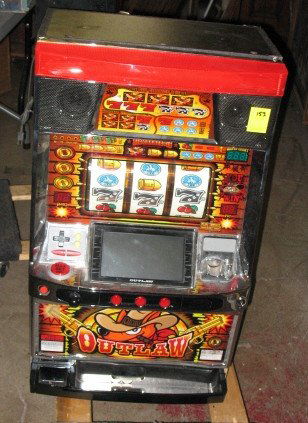 Slot Style Amusement Machine: Outlaw model style slot machine. For amusement only.