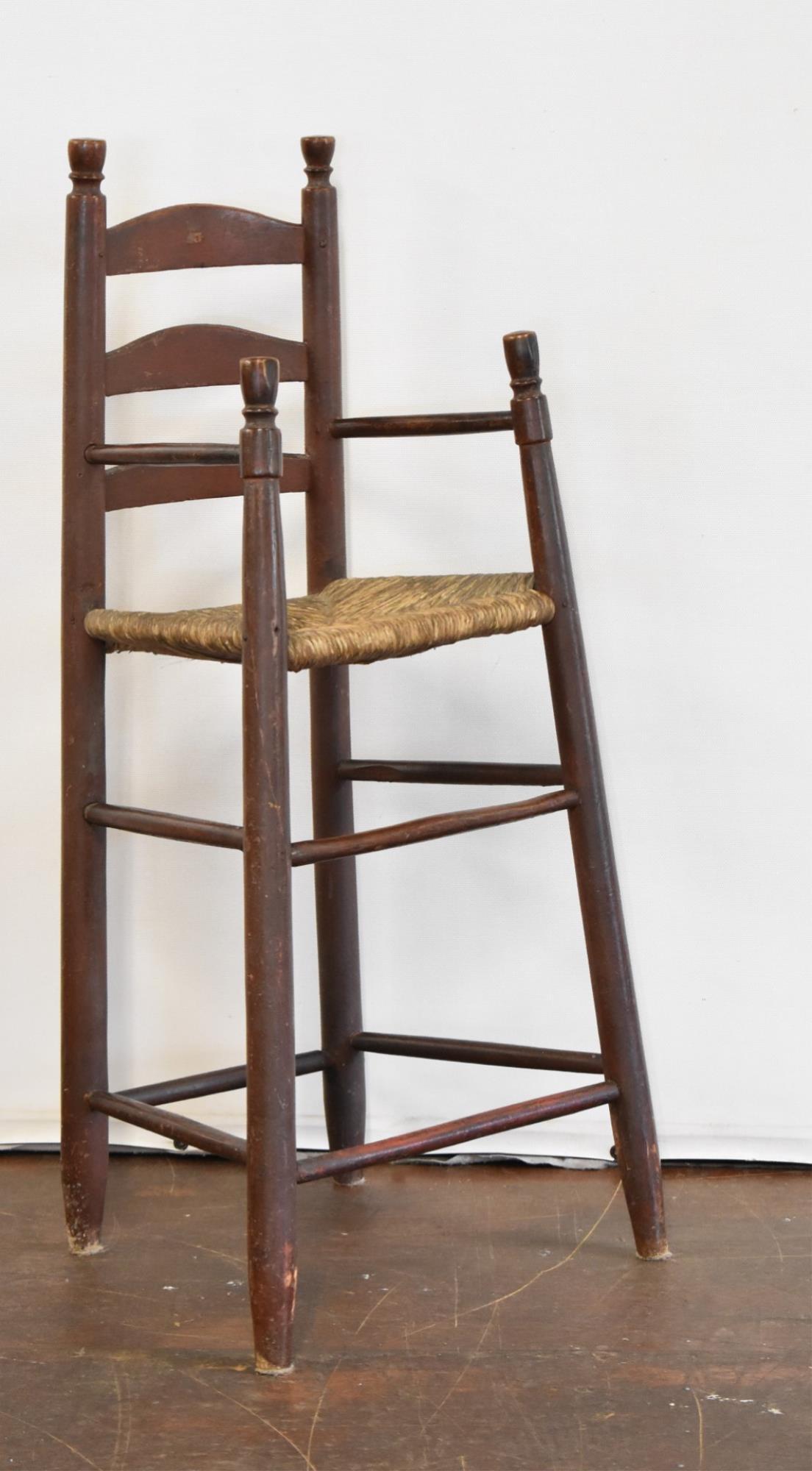 NEW ENGLAND SHAKER HIGH CHAIR: Early New England Shaker high chair features visible red painted finish. 37" tall, 14" wide and 12" deep.