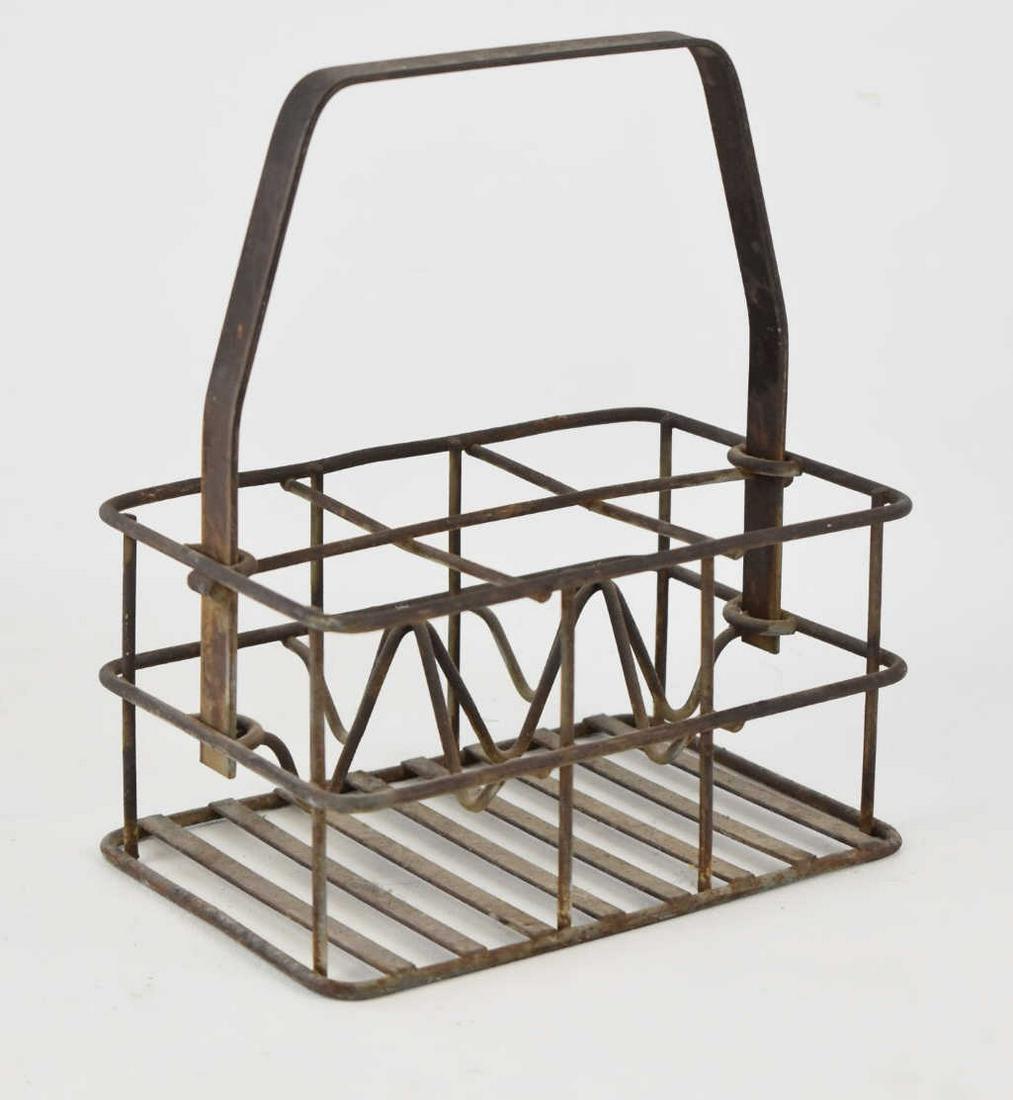 OKLAHOMA COCA-COLA BOTTLE COMPANY 6-BOTTLE CARRIER: Oklahoma (OKLA) Coca-Cola Bottle Company metal six-bottle carrier, circa 1940s. Measures 9-1/2" tall, 8" wide, and 5-1/2" deep.