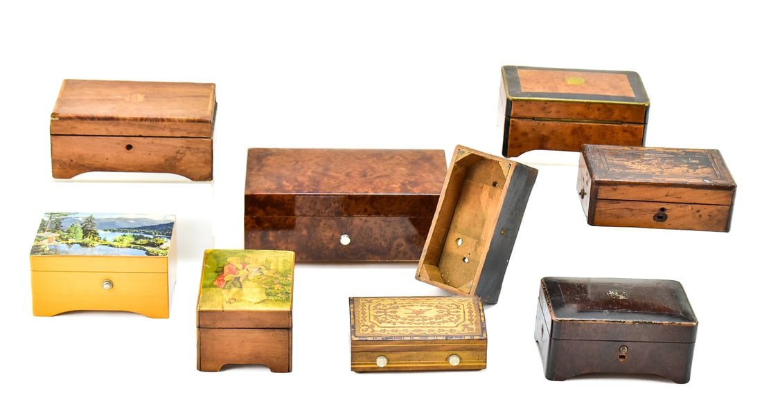 COLLECTION OF MUSIC BOXES: A collection of vintage and antique music boxes, most of which have burlwood veneer and decorative inlays.