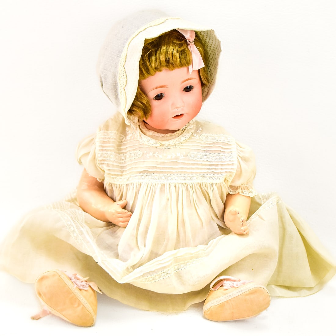 ANTIQUE NIPPON HILDA BABY DOLL: Circa 1920 Nippon Hilda baby doll with nightgown, wig and bonnet. Measures 19" tall.