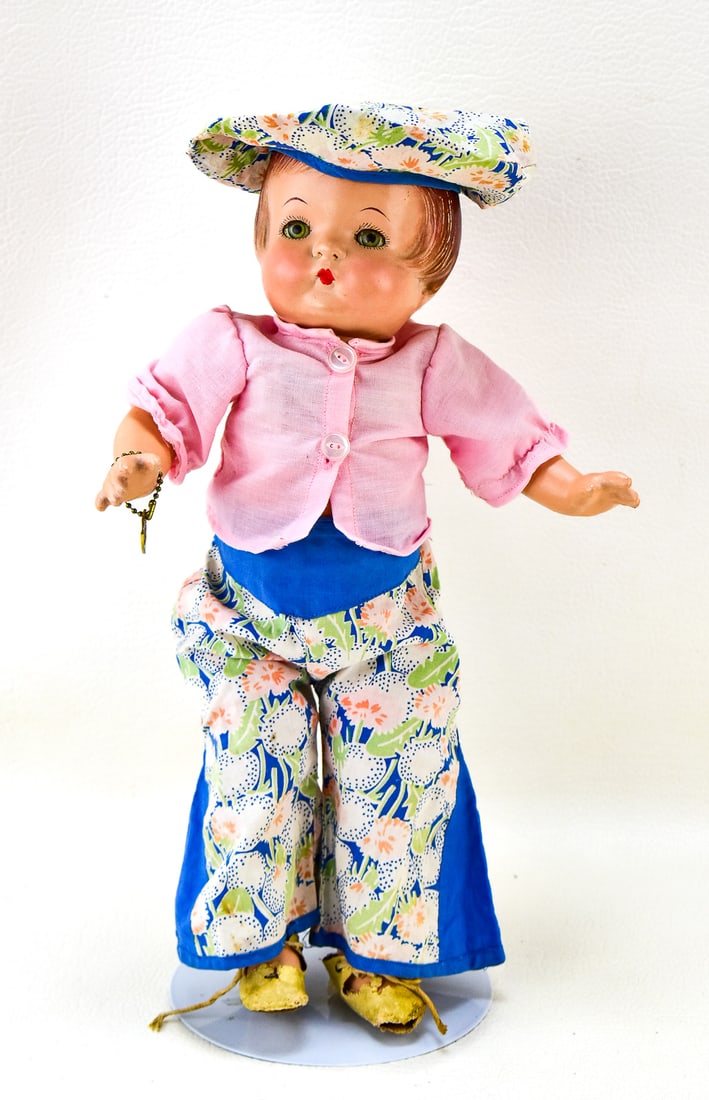 EFFANBEE PATSY JOAN DOLL: Effanbee Patsy Joan doll with play suit, tam cap, and metal heart bracelet. Measures 15" tall. 