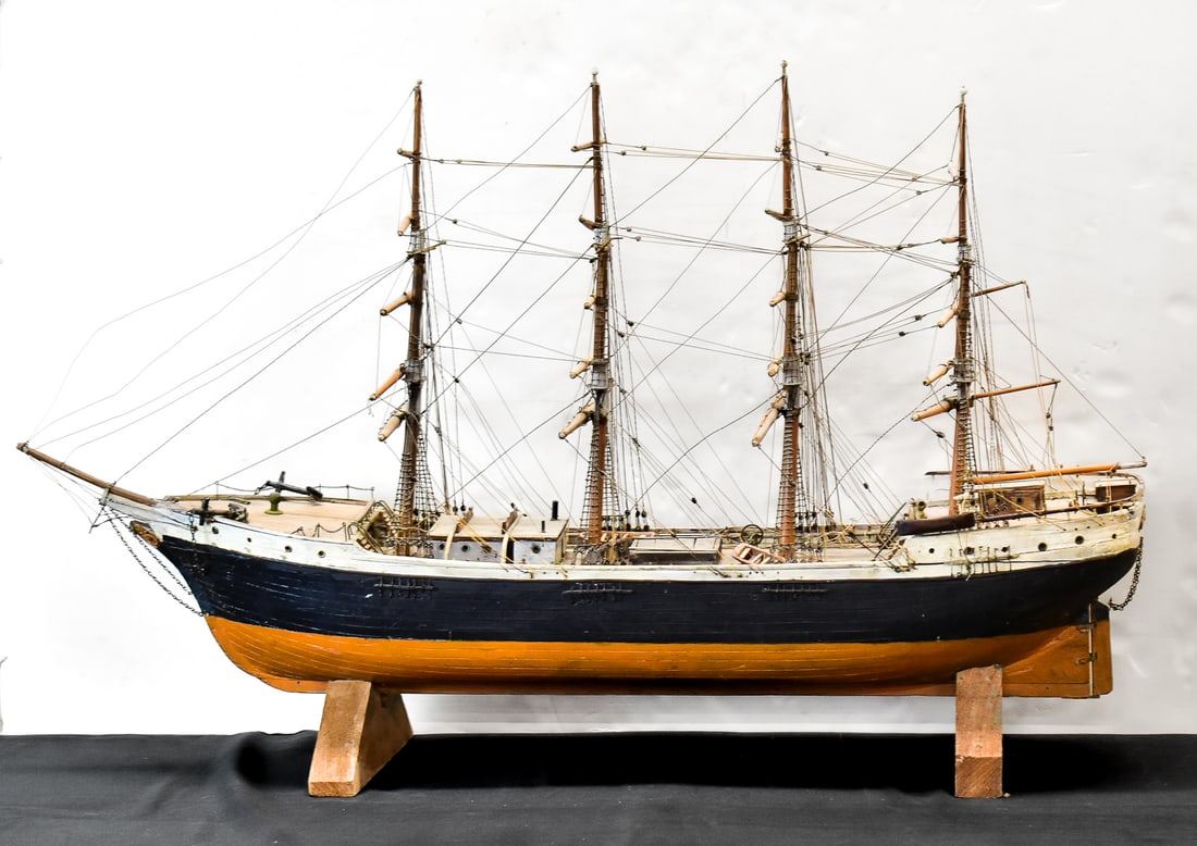 VINTAGE MODEL CLIPPER SHIP: A vintage hand-made model 4-mast clipper ship complete with anchors, lifeboats. The ship does not have sails.