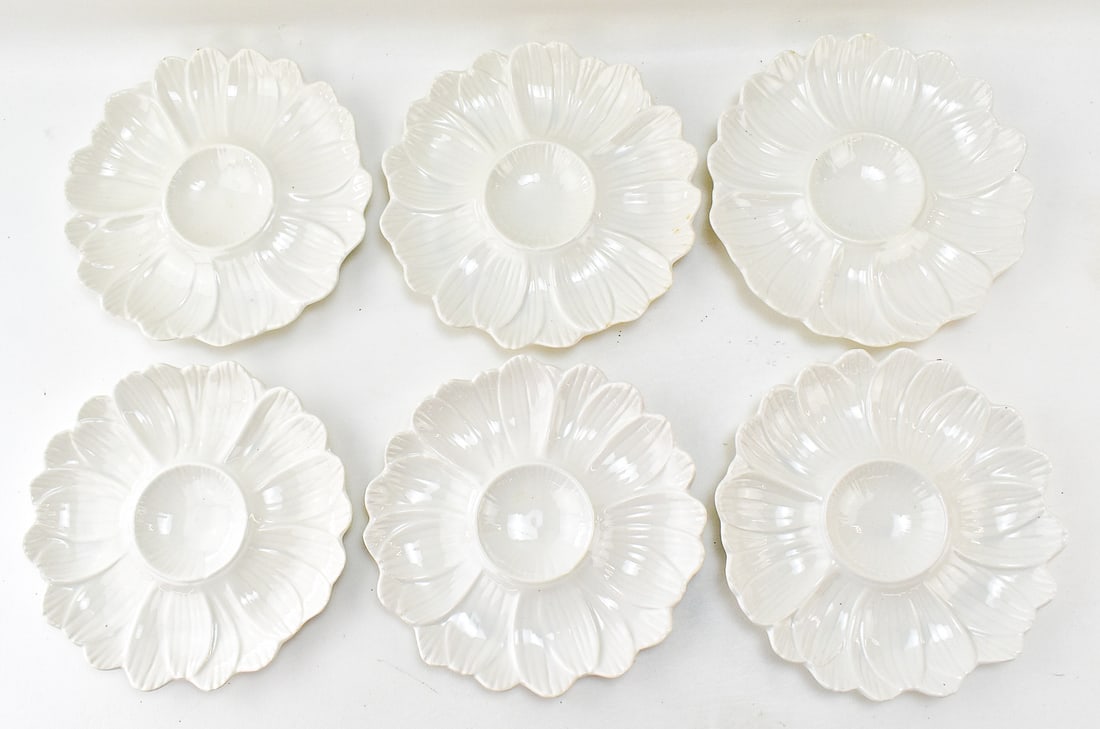 CALIFORNIA POTTERY WHITE DAISY-SHAPED ARTICHOKE PLATES: Includes six California U.S.A. Pottery white daisy-shaped artichoke plates, circa 1960s. Measures 9.5" diameter.