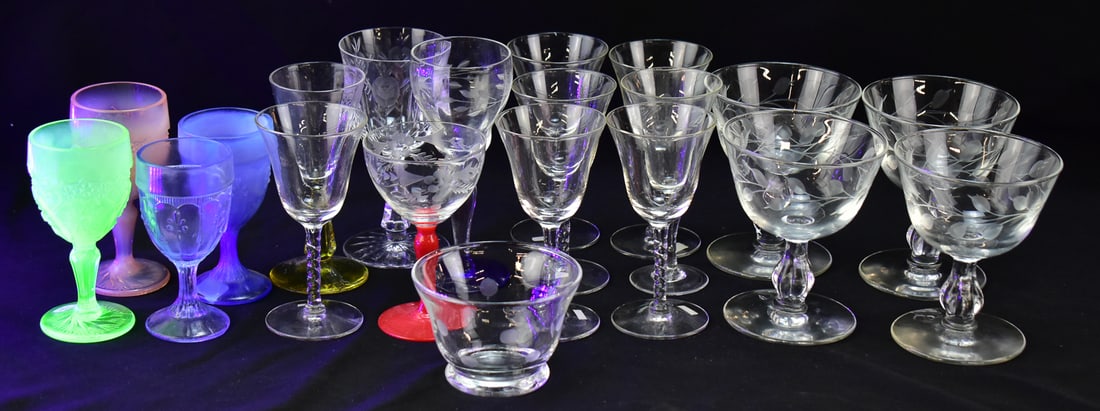 ASSORTED ETCHED CRYSTAL & GLASS STEMWARE: An assortment of etched stemware including four satin glass cordial goblets, one of which is uranium glass, fifteen sherry or apertif glasses, and four wine glasses.