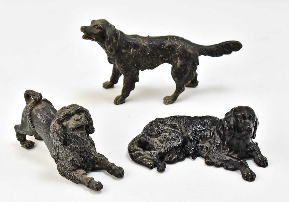 THREE CAST IRON DOG FIGURINES (1 of 3)