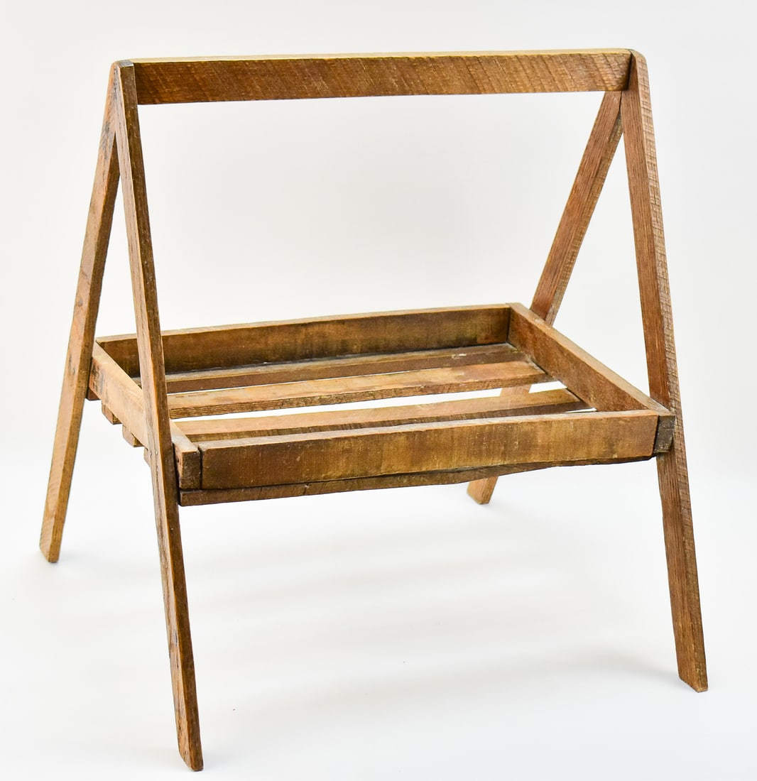 BERRY BASKET CARRIER: Wooden easel-form berry basket carrier, circa turn of 19th century. Measures 20.5" tall, 18.5" wide, and 17.5" deep. 