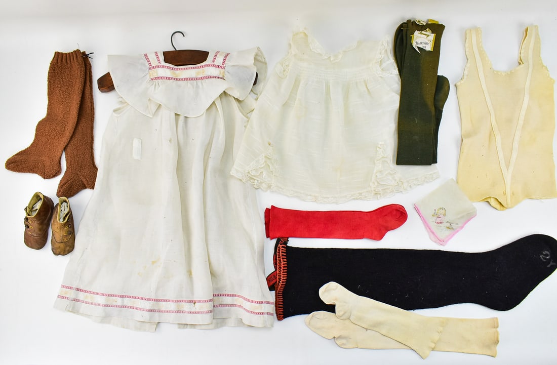 VICTORIAN CHILD'S GARMENTS: Victorian child's garments: dress, undershirt, three pairs of socks (Eureka Sock, Monarch), skirt, and handkerchief. 