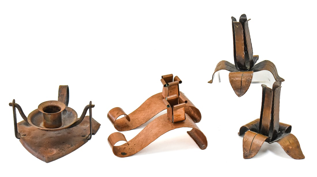 ARTS & CRAFTS CANDLESTICK ASSORTMENT: HUGO BERGER (ATTR.), D. METZINGER, AND MORE: Includes a D. Metzinger signed hammered copper candlestick pair (3.5" tall), Germany marked Arts & Crafts wrought iron sconce with finger loop attributed to Hugo Berger (2.5" tall) circa early 190