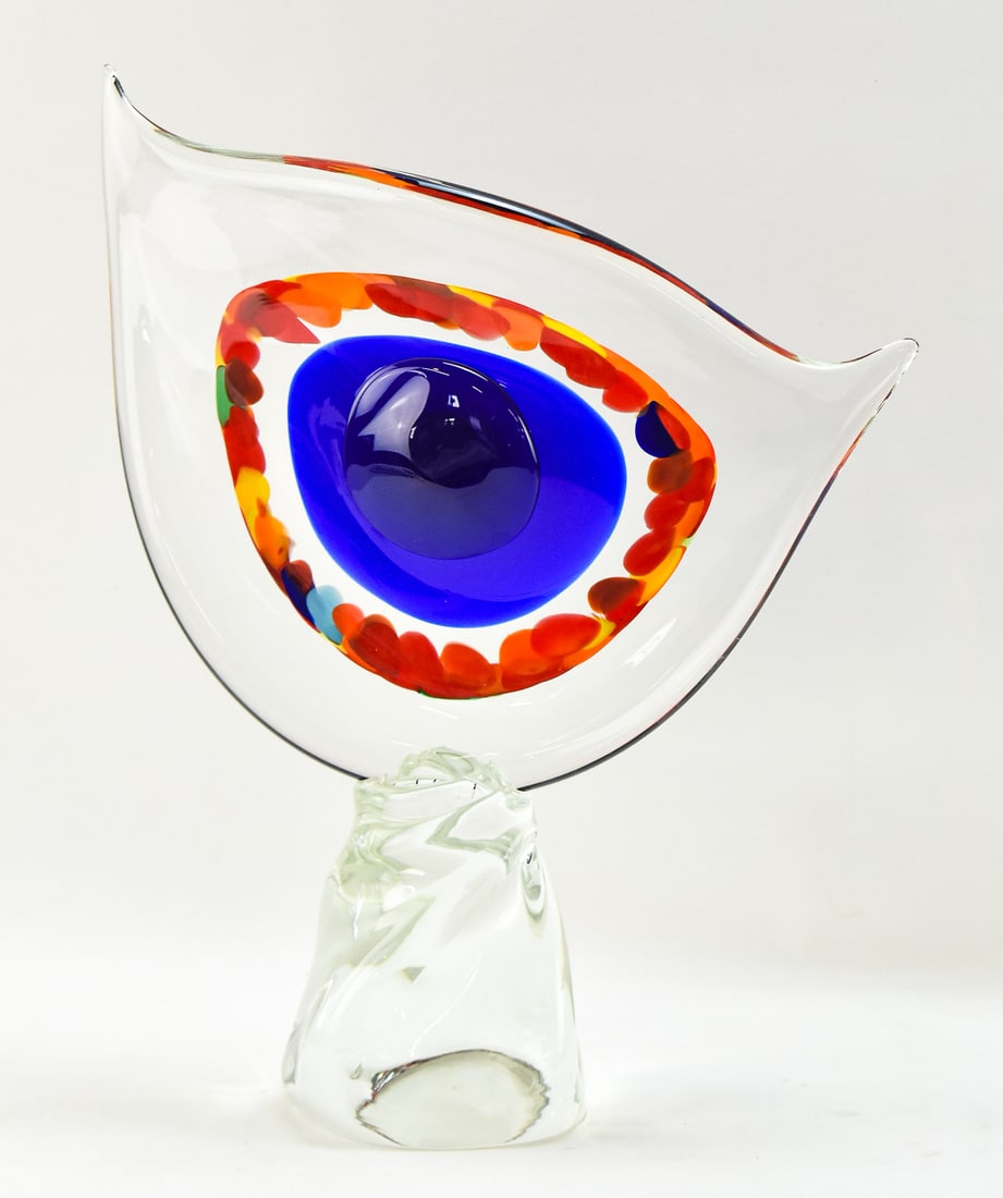 MURANO ART GLASS EYE SCULPTURE: Murano art glass clear eye with multicolored iris and blue pupil on a clear base. The sculpture measures 14 x 17.5 inches.