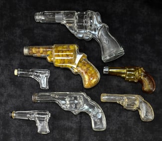 COLLECTION OF GLASS CANDY GUN CONTAINERS