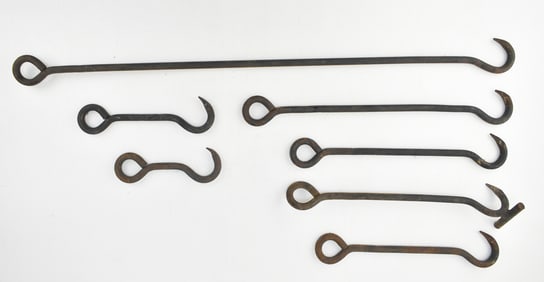 SEVEN ANTIQUE WROUGHT IRON INDUSTRIAL HOOKS