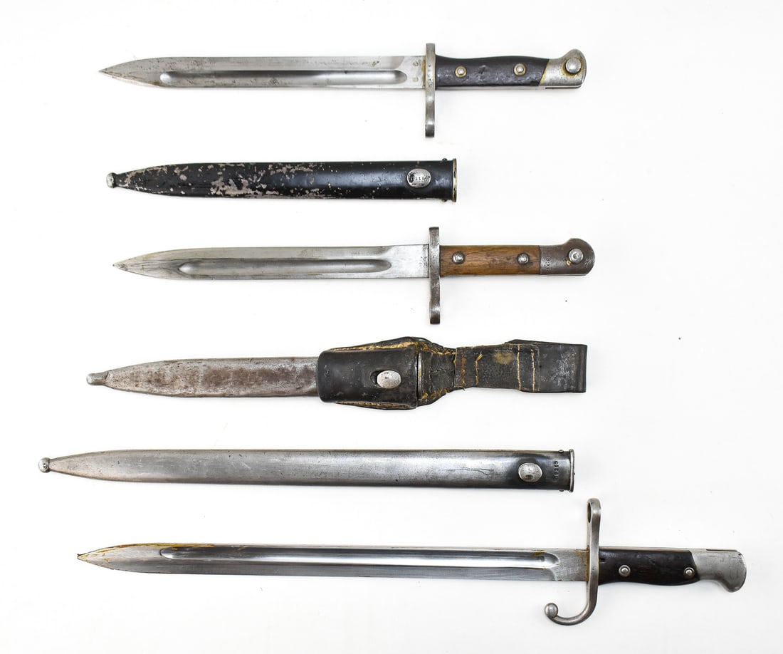 COLLECTION OF MAUSER BAYONETS: A collection of various pattern Mauser bayonets, including: a Turkish M1935 bayonet for the M1893 and M1903 Turkish Mausers with scabbard and leather belt frog, a Argentinian Modello 1909 Argentinian 