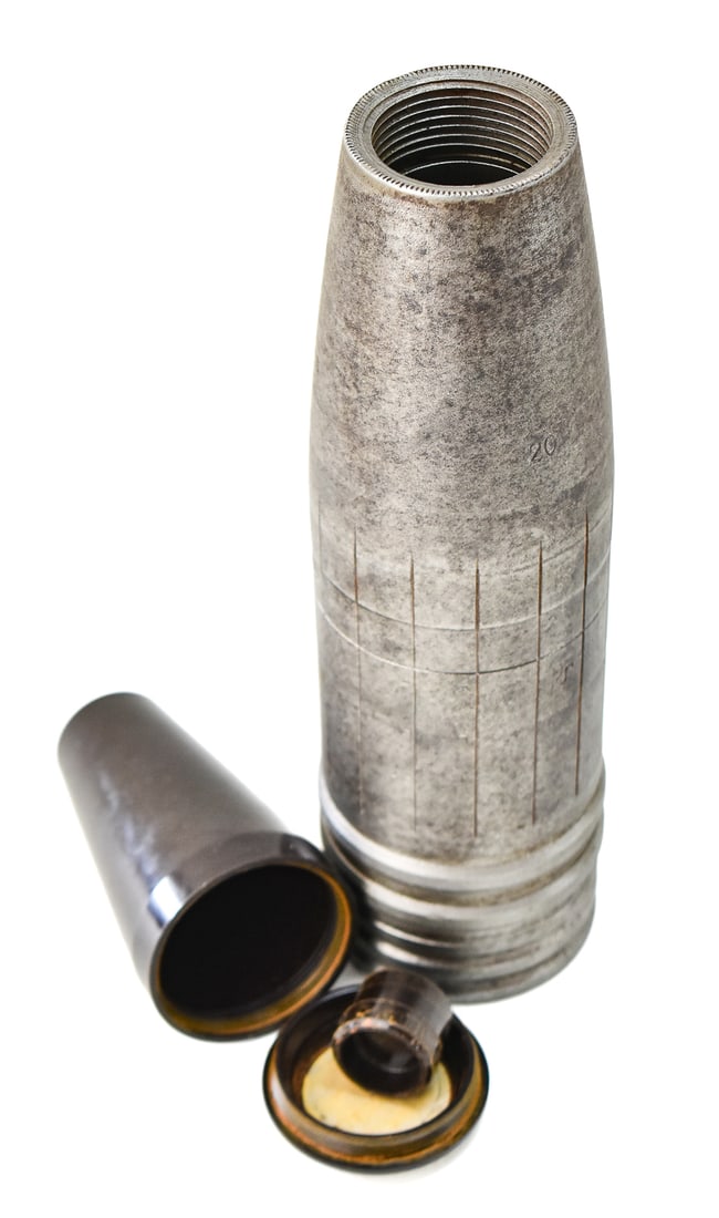 WWII GERMAN MILITARY 88 MM HE SHRAPNEL FLAK SHELL & FUSE HOLDER: An inert German 88 mm shrapnel round flak shell with scoring and appropriate marks as "Pr" and "13sk644", and a 1938 German bakelite military fuse holder or carrier.