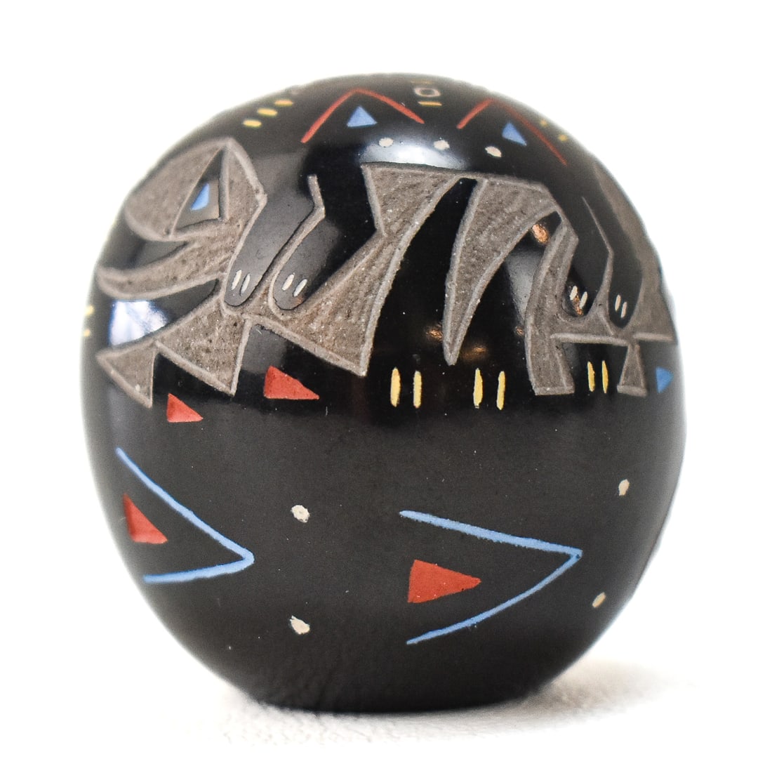 RAY TAFOYA SIGNED SANTA CLARA PUEBLO MINIATURE POLYCHROME SGRAFITTO COYOTA AND HARE BLACKWARE EGG: Ray Tafoya (1956-1994) signed Santa Clara pueblo miniature polychrome blackware egg with sgraffito painted coyote and hare motif, circa late 20th century.
